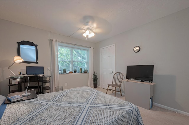bedroom featuring baseboards, a ceiling fan, and carpet floors