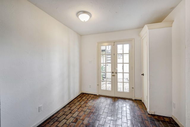 7628 Del Monte Dr, Houston, TX 77063 - doorway to outside with french doors, brick floor, and baseboards