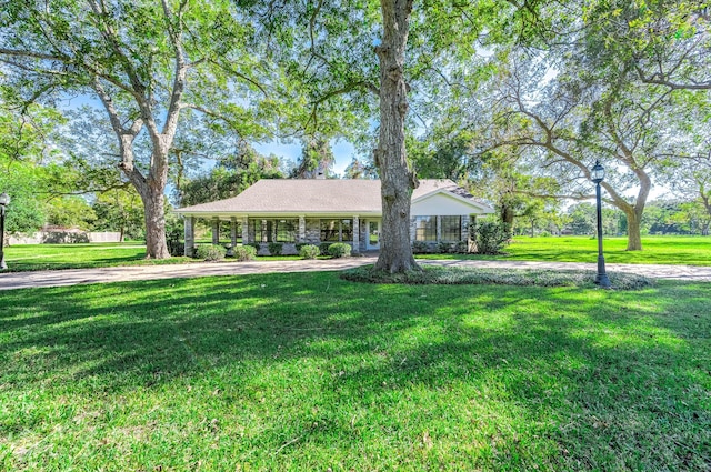 ranch-style house with a front lawn
