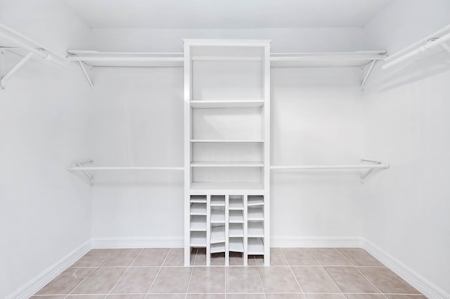 spacious closet featuring tile patterned flooring
