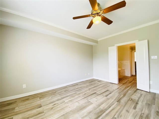 empty room featuring light wood-style floors, baseboards, crown molding, and ceiling fan