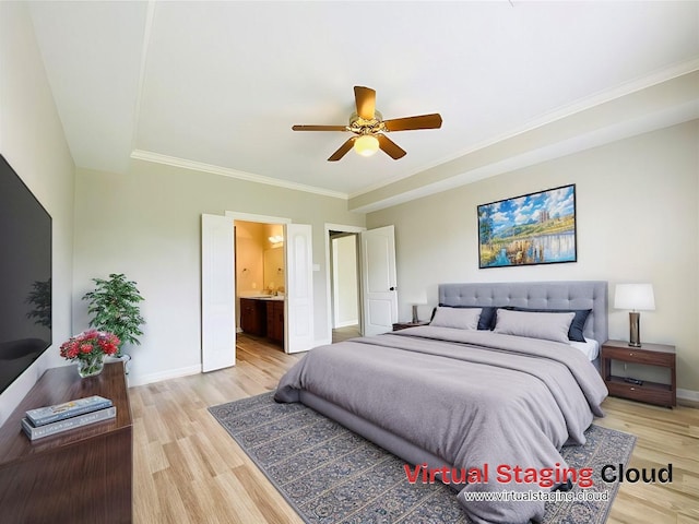 bedroom with light wood-style floors, baseboards, crown molding, and ensuite bathroom