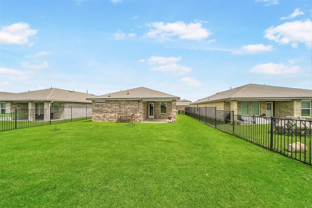 rear view of house featuring brick siding and a patio area