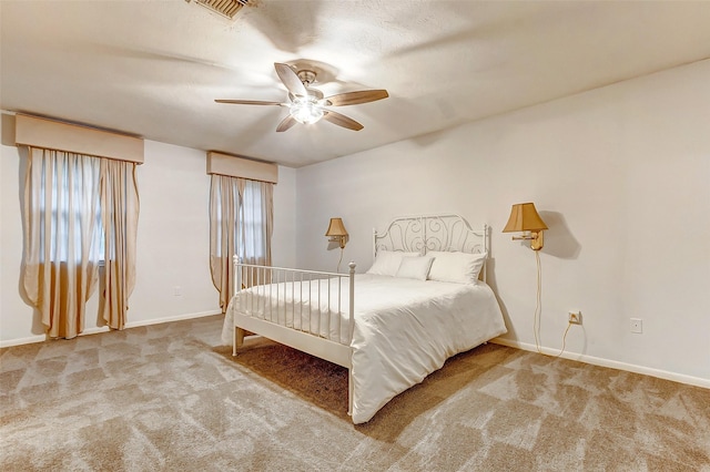 bedroom with carpet, visible vents, and baseboards
