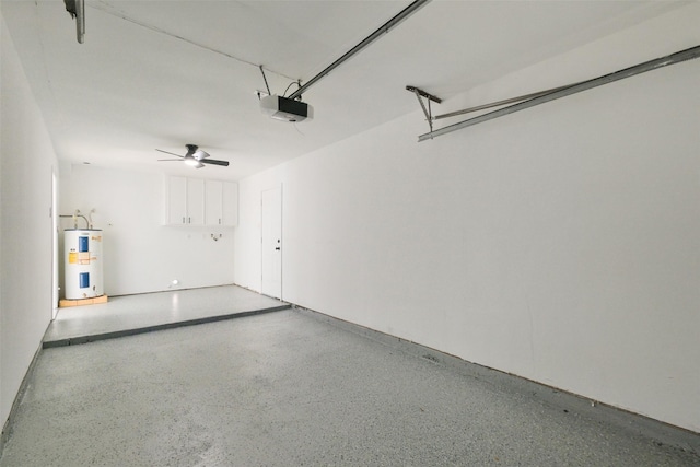 garage featuring a garage door opener, a ceiling fan, and water heater