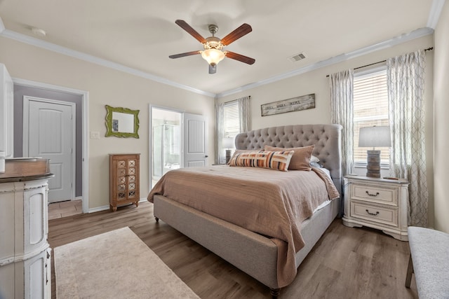 6857 Dogwood Cliff Ln, Dickinson, TX 77539 - bedroom with ensuite bathroom, ornamental molding, visible vents, wood finished floors, and baseboards