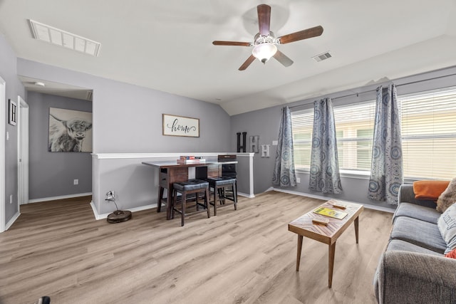 6857 Dogwood Cliff Ln, Dickinson, TX 77539 - living area featuring visible vents, ceiling fan, baseboards, and wood finished floors