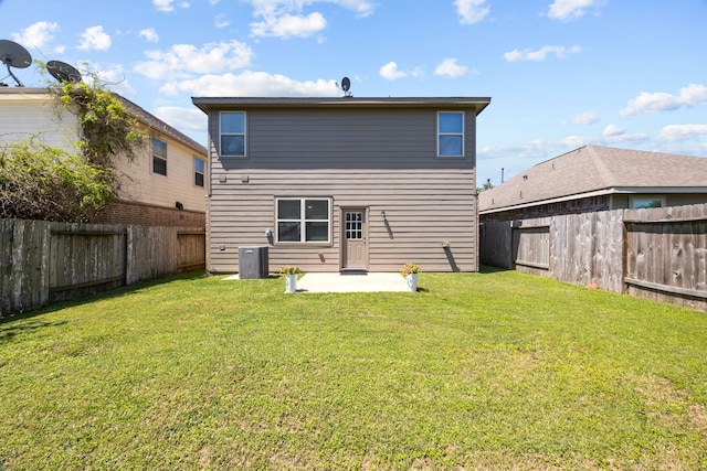 6857 Dogwood Cliff Ln, Dickinson, TX 77539 - rear view of house with central air condition unit, a patio, a yard, and a fenced backyard