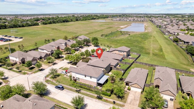 6857 Dogwood Cliff Ln, Dickinson, TX 77539 - bird's eye view featuring a water view and a residential view