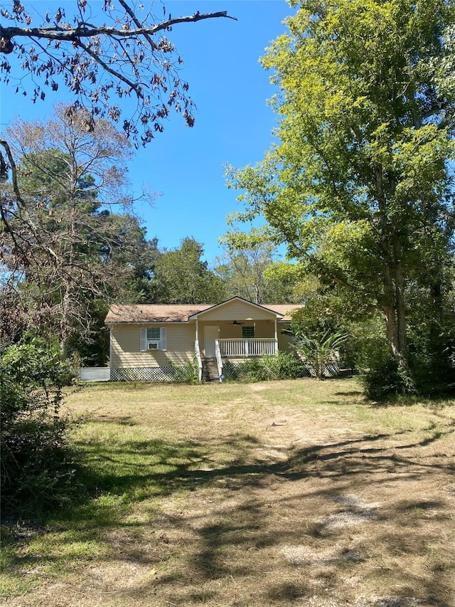 exterior space featuring a porch and a front lawn