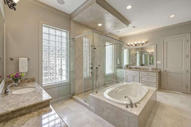 full bathroom featuring a shower stall, a garden tub, and a healthy amount of sunlight