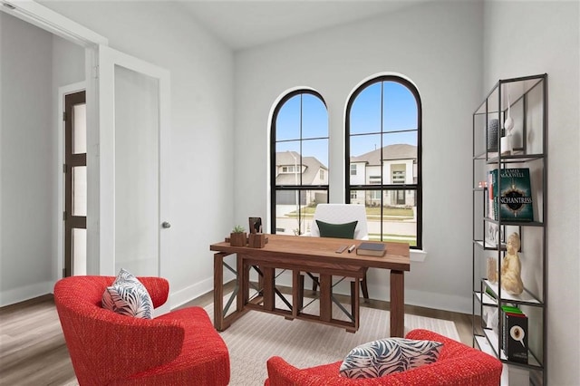 15615 Broadway Bnd, Conroe, TX 77302 - home office featuring baseboards and wood finished floors