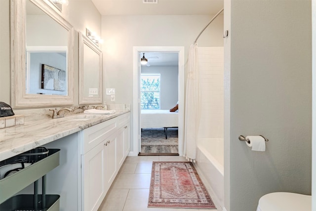 206 Damar Cv, Canyon Lake, TX 78133 - full bathroom featuring toilet, tile patterned floors, double vanity, and a sink