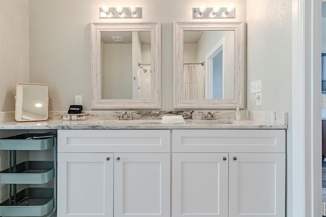 206 Damar Cv, Canyon Lake, TX 78133 - full bath with double vanity, visible vents, and a sink