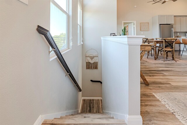 206 Damar Cv, Canyon Lake, TX 78133 - stairway with baseboards and wood finished floors