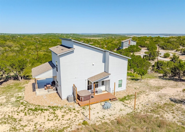 206 Damar Cv, Canyon Lake, TX 78133 - back of house featuring a deck and central AC