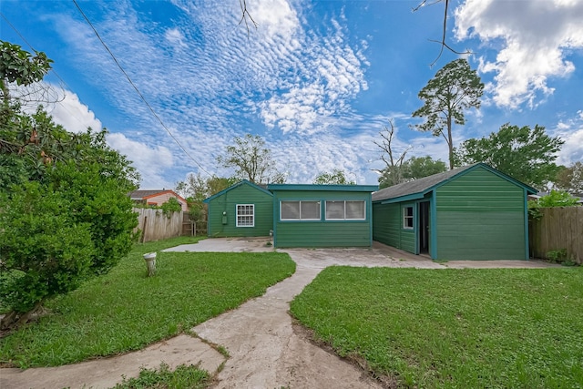 exterior space featuring a yard, a patio, and fence
