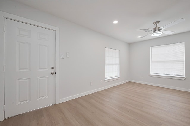 empty room with recessed lighting, light wood finished floors, baseboards, and ceiling fan