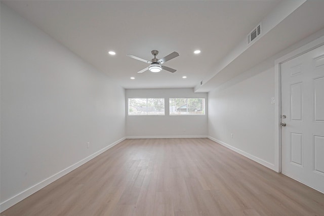 spare room with ceiling fan, light wood-type flooring, visible vents, recessed lighting, and baseboards