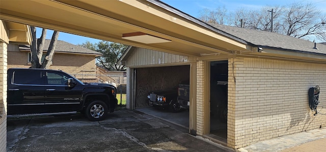 garage with concrete driveway
