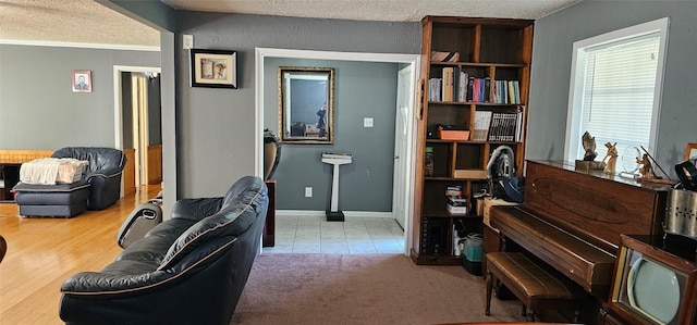 office space featuring baseboards and a textured ceiling