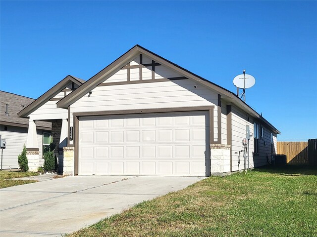 view of front facade with central AC unit, an attached garage, fence, concrete driveway, and a front lawn