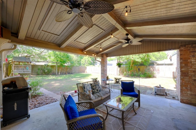 view of patio / terrace with area for grilling, an outdoor living space, a fenced backyard, and a ceiling fan