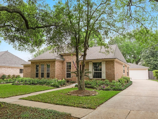 ranch-style home with a front lawn, brick siding, roof with shingles, and a garage