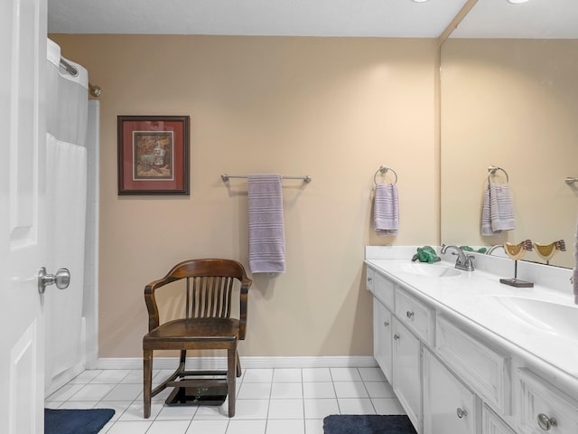 bathroom featuring tile patterned flooring, a sink, double vanity, and curtained shower