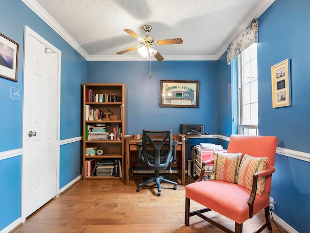 office space featuring hardwood / wood-style flooring, ceiling fan, crown molding, and a textured ceiling