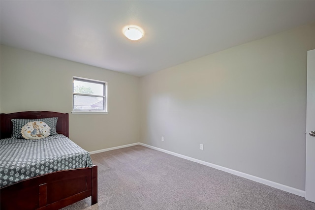 111 N 11th St, Highlands, TX 77562 - bedroom with light colored carpet and baseboards