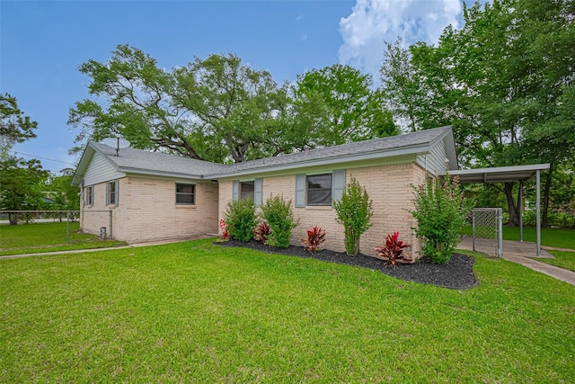 111 N 11th St, Highlands, TX 77562 - view of front facade with a carport and brick siding