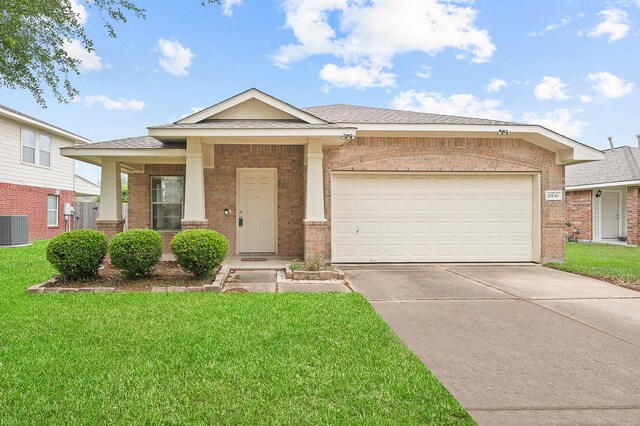 ranch-style home featuring brick siding, a front lawn, a garage, and concrete driveway