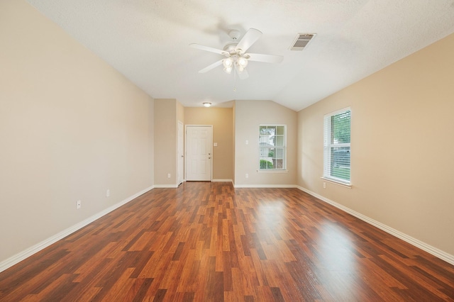empty room featuring ceiling fan, baseboards, wood finished floors, and visible vents