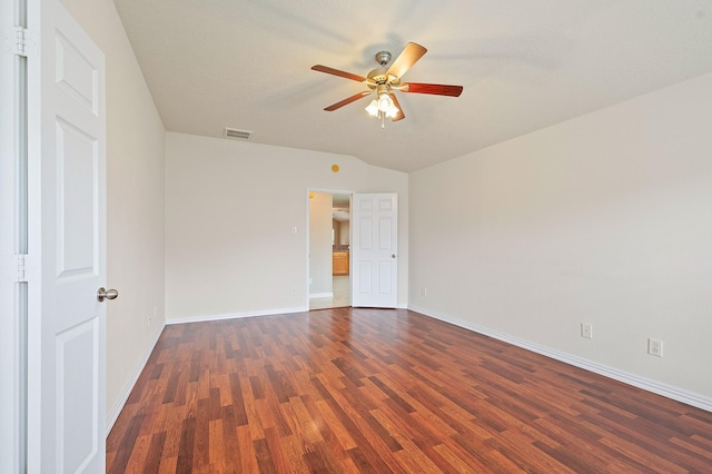 unfurnished bedroom featuring vaulted ceiling, baseboards, visible vents, wood finished floors, and ceiling fan