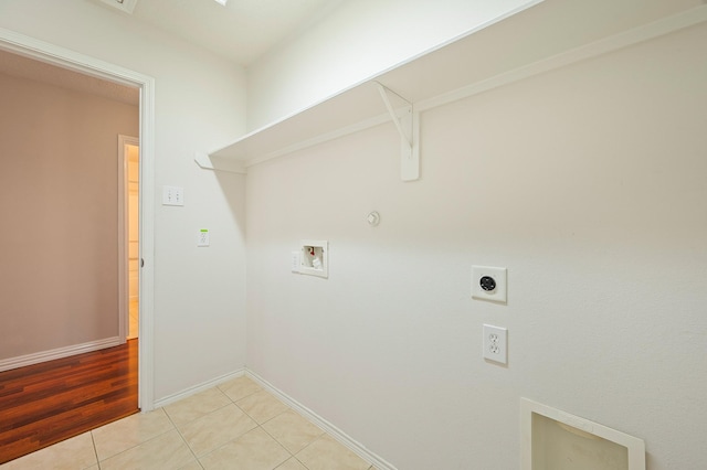 washroom with electric dryer hookup, light tile patterned flooring, laundry area, hookup for a gas dryer, and washer hookup