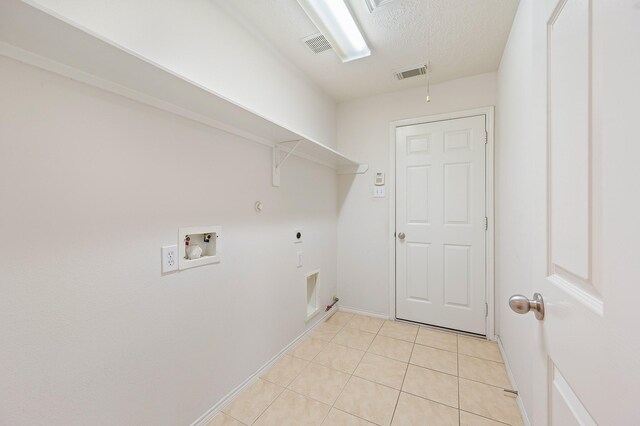 clothes washing area featuring electric dryer hookup, hookup for a gas dryer, visible vents, laundry area, and washer hookup
