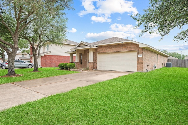 ranch-style house with an attached garage, brick siding, a front yard, and concrete driveway