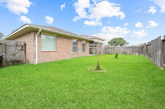view of yard with a fenced backyard