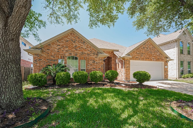 19915 Hardsville Dr, Spring, TX 77388 - traditional home with brick siding, an attached garage, driveway, and roof with shingles