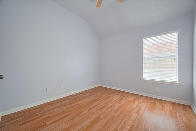 19915 Hardsville Dr, Spring, TX 77388 - unfurnished room featuring vaulted ceiling, light wood-style flooring, baseboards, and a ceiling fan