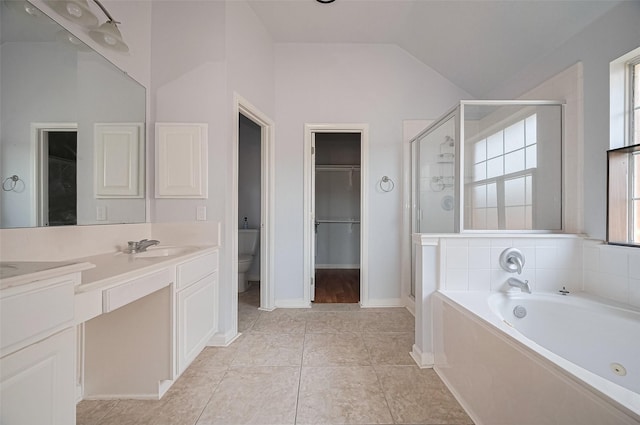 19915 Hardsville Dr, Spring, TX 77388 - bathroom with a stall shower, a bath, vaulted ceiling, double vanity, and toilet