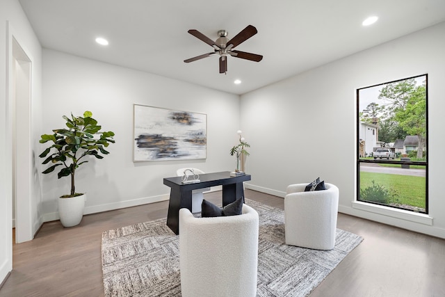 office area with baseboards, recessed lighting, ceiling fan, and wood finished floors