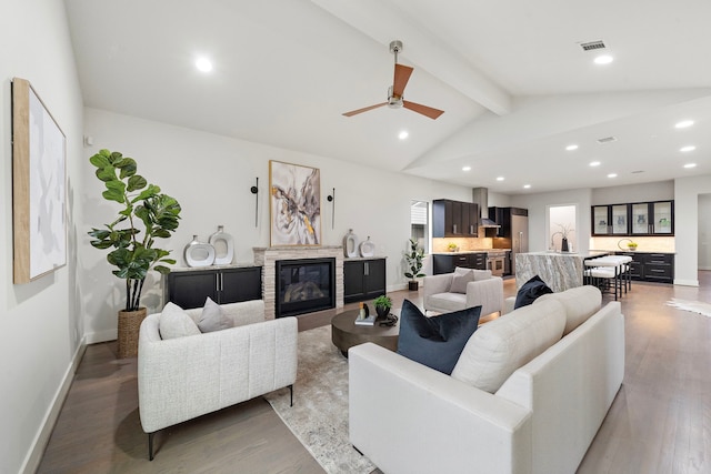 1906 Ebony Ln, Houston, TX 77018 - living room with recessed lighting, a glass covered fireplace, light wood-style flooring, a ceiling fan, and baseboards