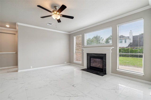 unfurnished living room featuring visible vents, baseboards, a ceiling fan, crown molding, and marble finish floor
