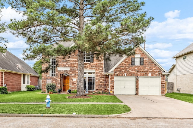 view of front facade with brick siding, a front lawn, and driveway