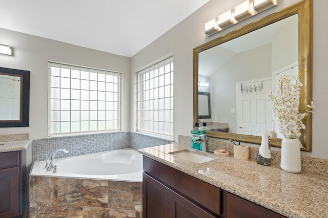 14942 Gray Ridge Dr, Houston, TX 77082 - full bathroom featuring a bath, two vanities, and a sink