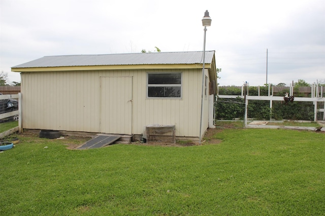 view of shed with fence