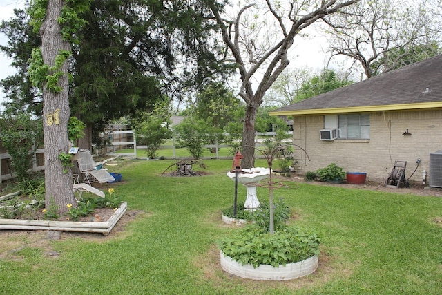 view of yard with cooling unit and central air condition unit