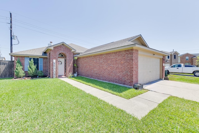 single story home with brick siding, a front lawn, an attached garage, and concrete driveway